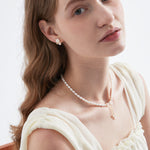 STMG Natural Pearl with Mother of Pearl Flower Necklace on neck with matching earrings on ear