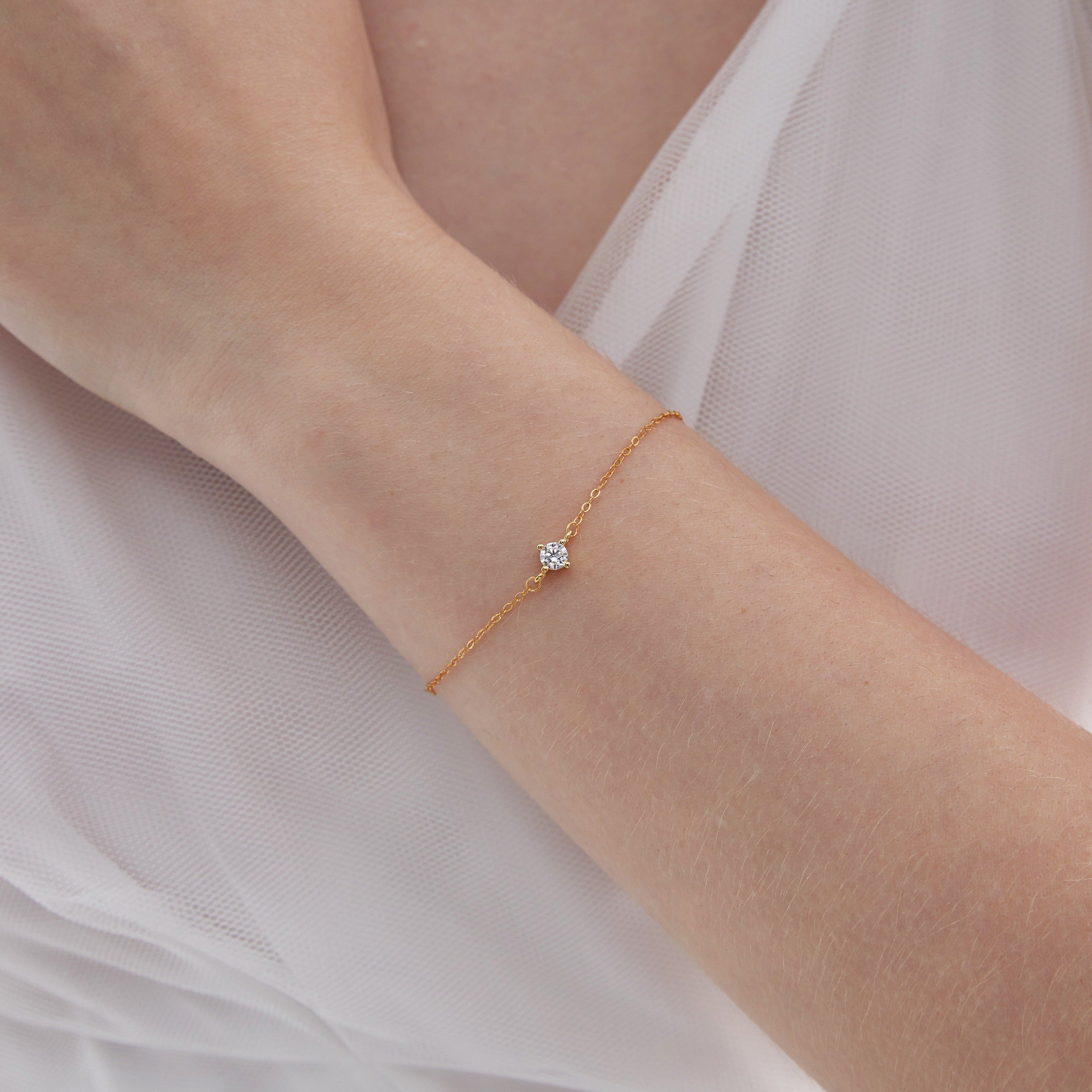 STMG Minimalist CZ Diamond Bracelet in gold on hand