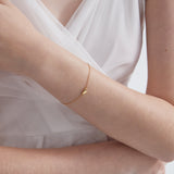 STMG Tiny Sweet Heart Bracelet in gold on hand