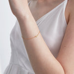 STMG Tiny Sweet Heart Bracelet in gold on hand