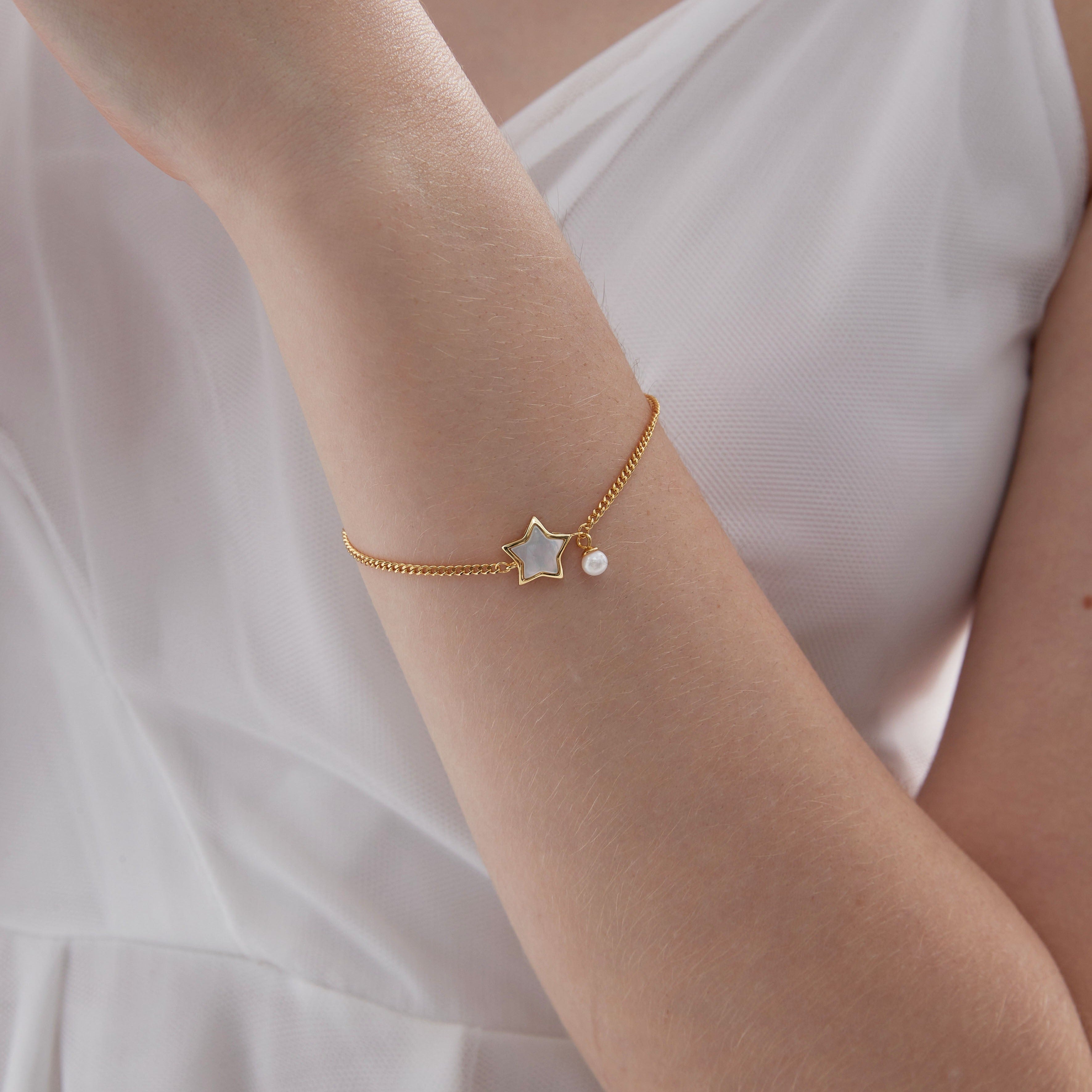 STMG Star with Pearl Bracelet on hand