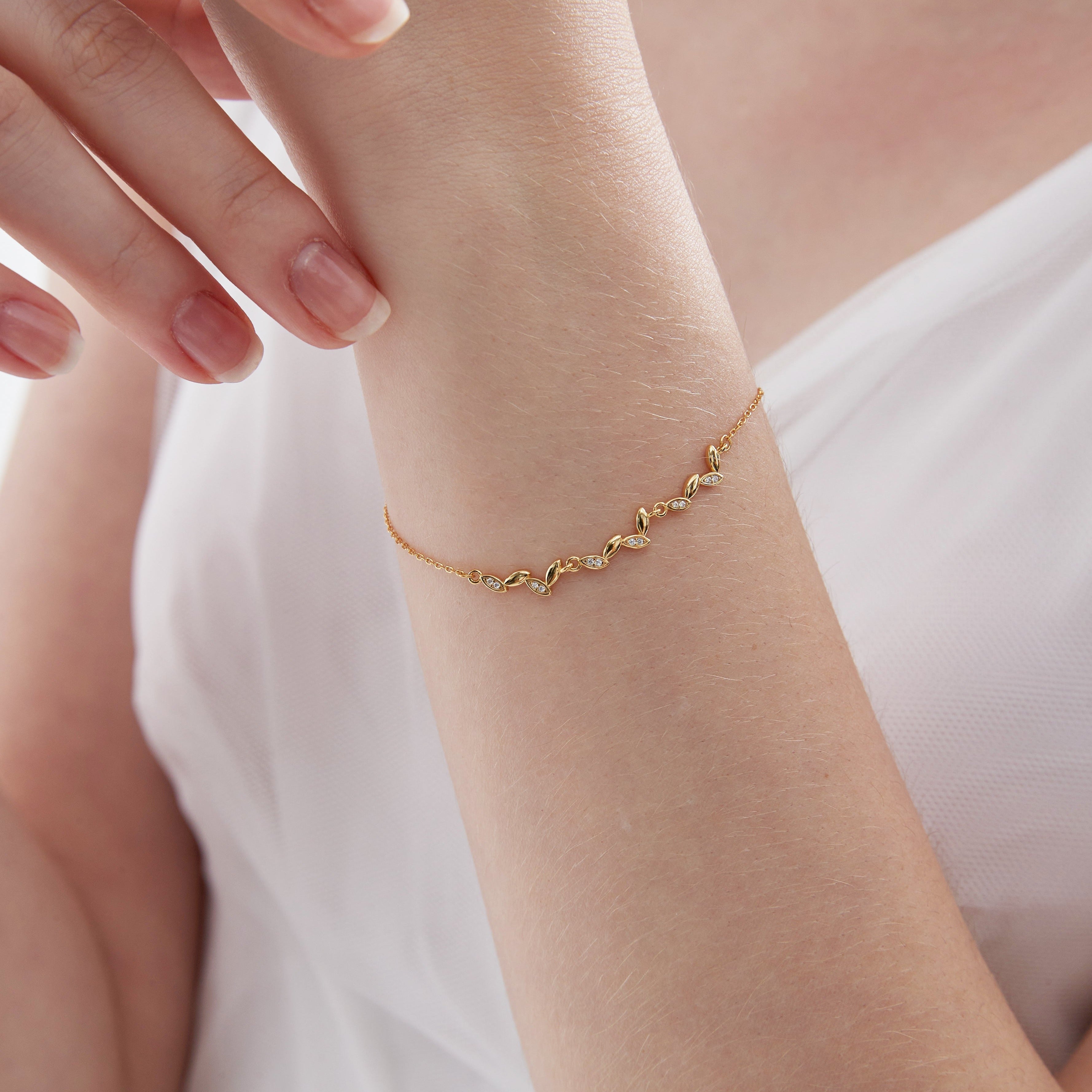 STMG Olive Leaf  Bracelet in gold on hand