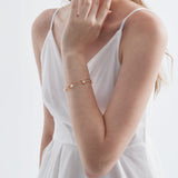 Duo Layer Natural Pearl Bracelet in gold on hand