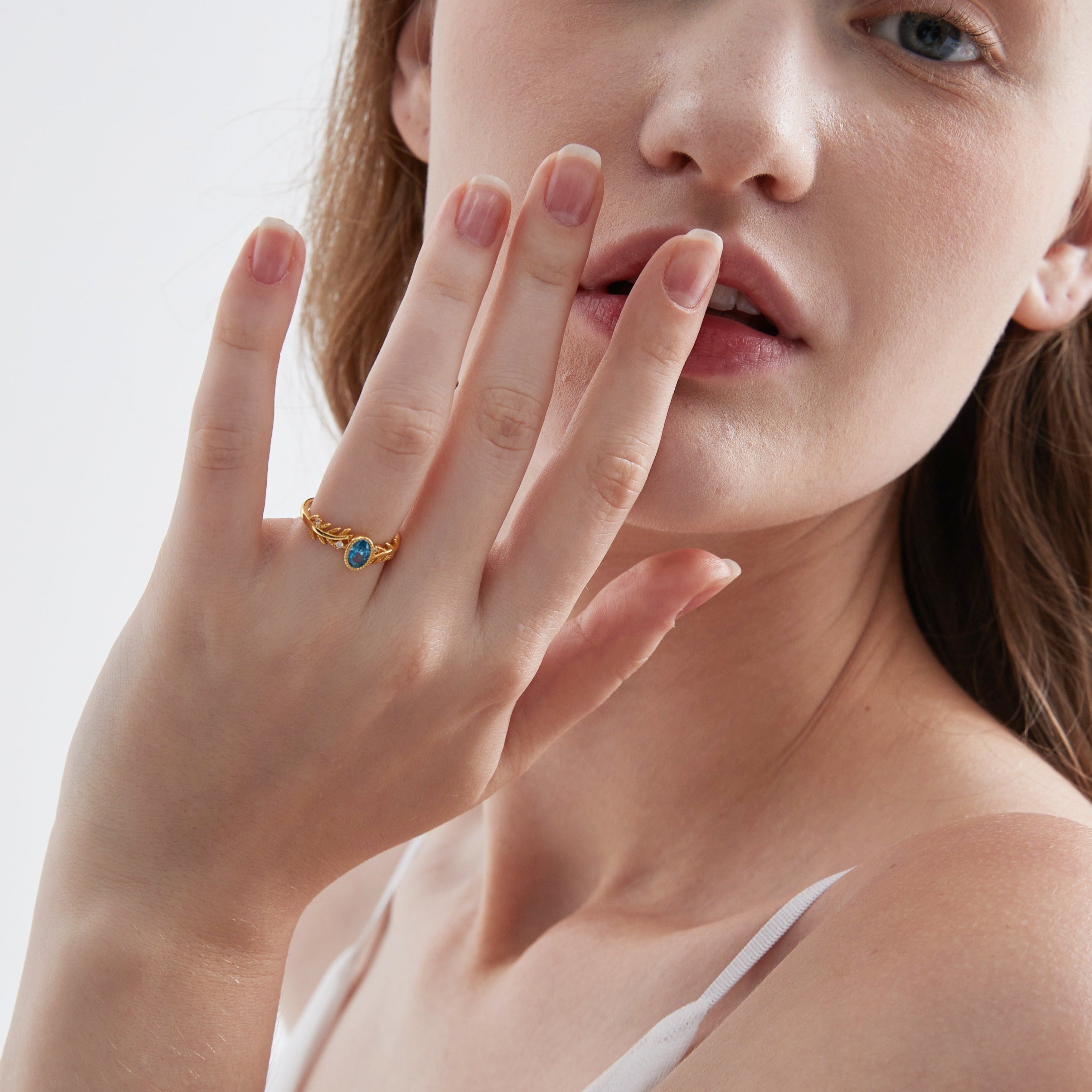 Blue Topaz on Olive Leaf Ring on hand