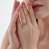 Blue Topaz on Olive Leaf Ring on hand