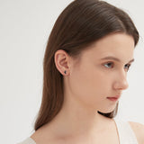 Black Crescent Moon Stud Earrings on ear