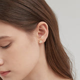 Dogwood Blossom Stud Earrings on ear