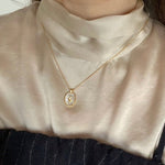 STMG Mother of Pearl with Tulip Necklace on neck