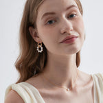 STMG Pearl Wreath Dangle Hoops on ear