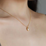 STMG Natural Pearl Necklace in gold on neck