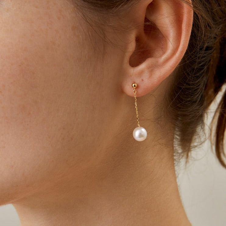 STMG Pearl Drop Dangle Earrings on ear