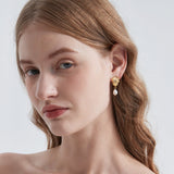 STMG Natural Pearl Dangle Earrings on ear